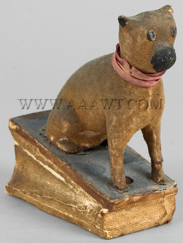 Antique Squeak Toy, Seated Dog with Pink Ribbon, angle view